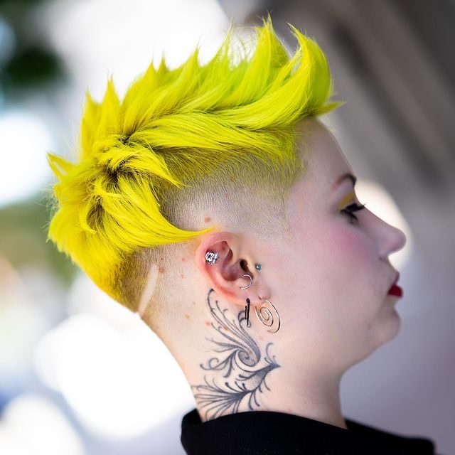 Image of a woman with a bad yellow haircut looking ahead