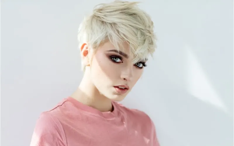 Beauty portrait of fashion blond model in messy short haircut