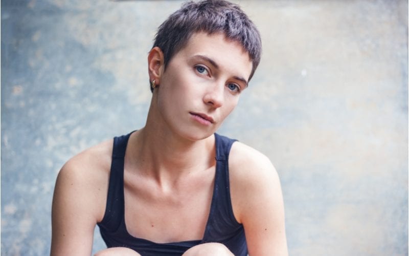 Beautiful stylish young woman with short haircut, close-up portrait, shot of head with a pixie cut
