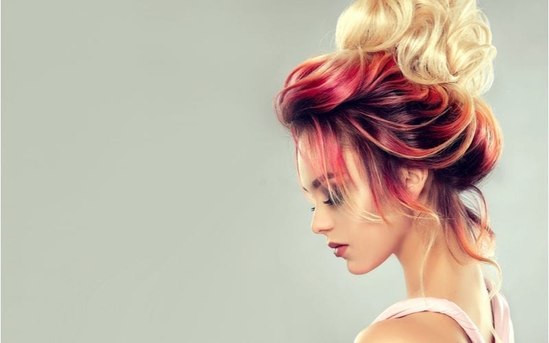 Beautiful woman with an elaborate multi-colored hairstyle on her head