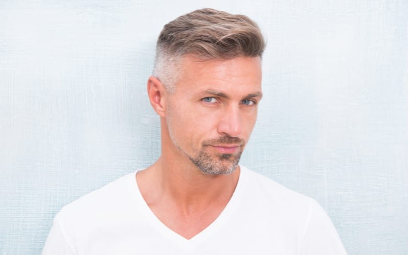 Grizzle hair suits him. Deal with gray roots. Man attractive well groomed facial hair. Barber shop concept. Barber and hairdresser. Man mature good looking model. Silver hair shampoo. Anti ageing.