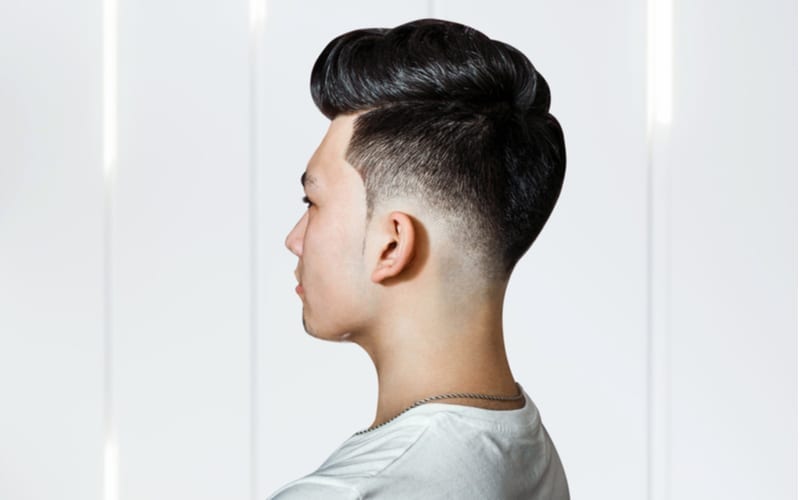 Young guy brunette with pompadour volume haircut 50s - 60s