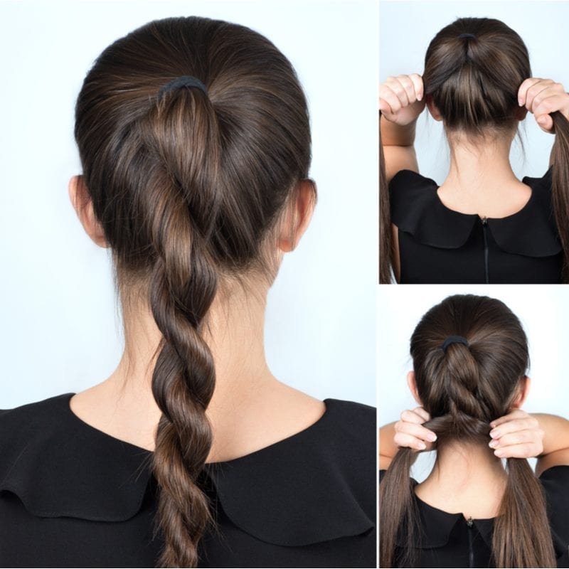Woman doing a two strand twist