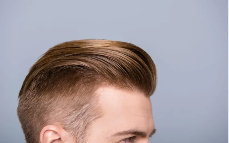 Cropped photo portrait of man's head with health hair and stylish haircut