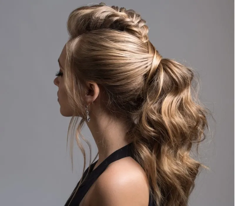 Woman with a braid tail hairstyle for a piece on how to braid wavy hair