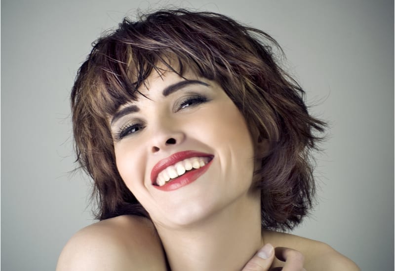 Photo of beautiful laughing woman with short hair