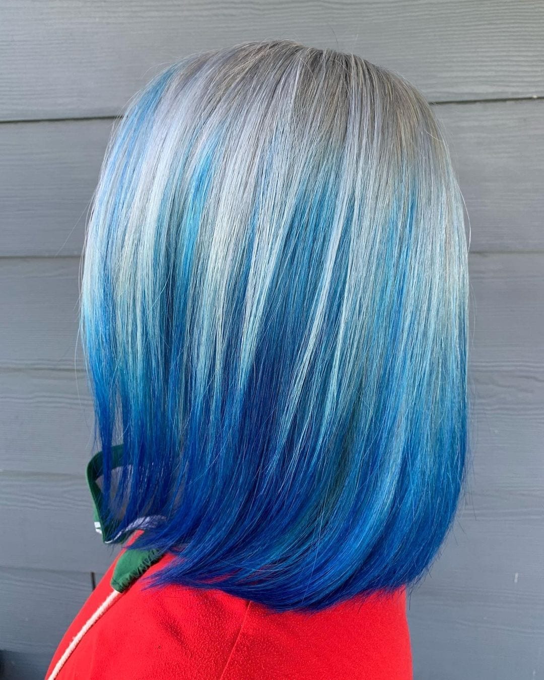 Person with long hair that is blue and fades to grey at the roots