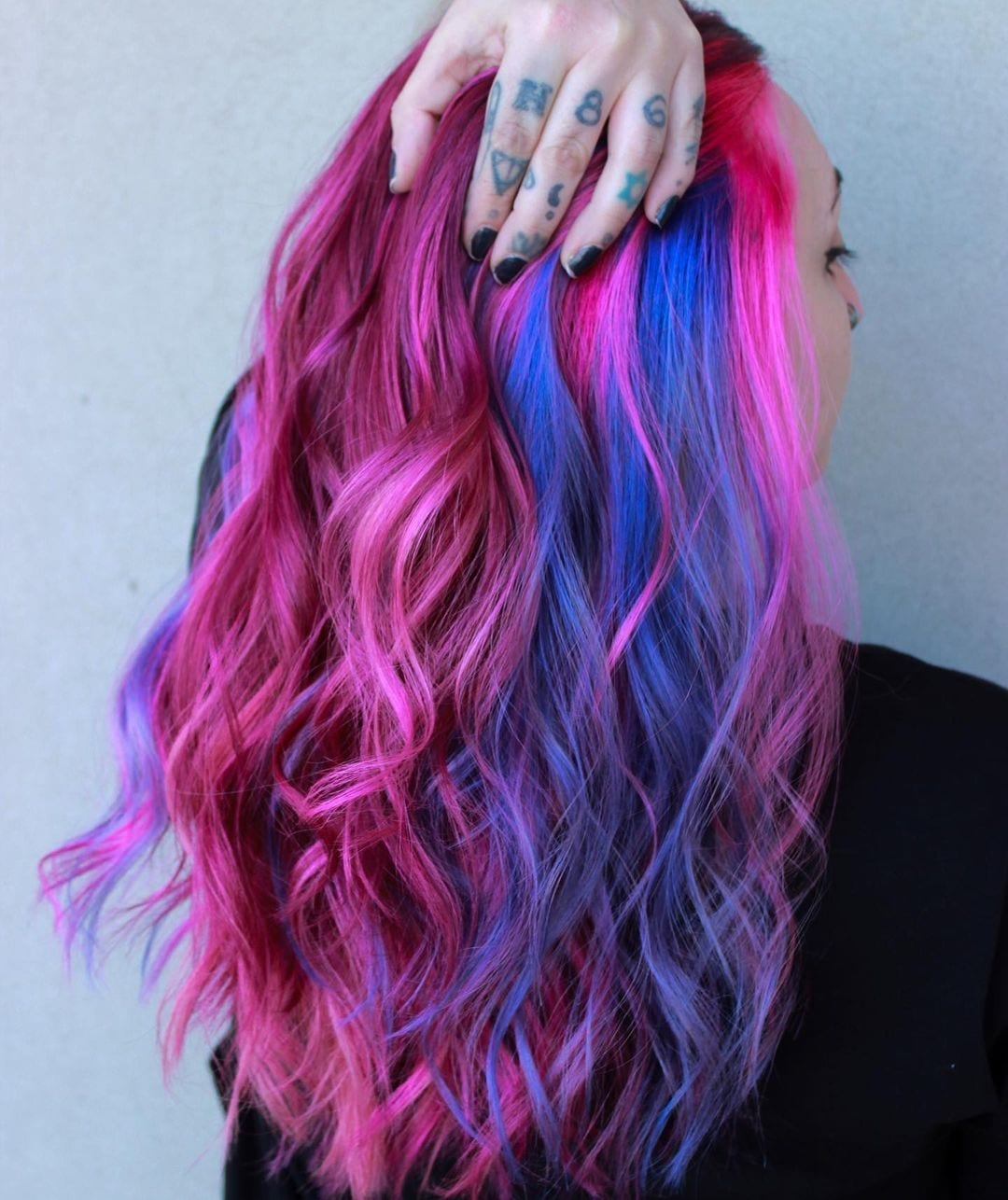 Galaxy hair featuring bright purple and pink highlights