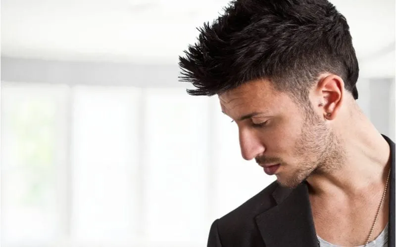 Man with a brushed-up taper fade haircut in a casual blazer