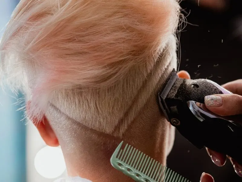 A chevron shaved quiff undercut shaved haircut for women