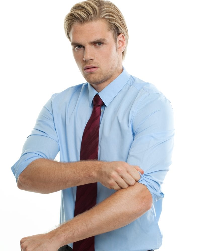 Person rolling up his sleeves to fight