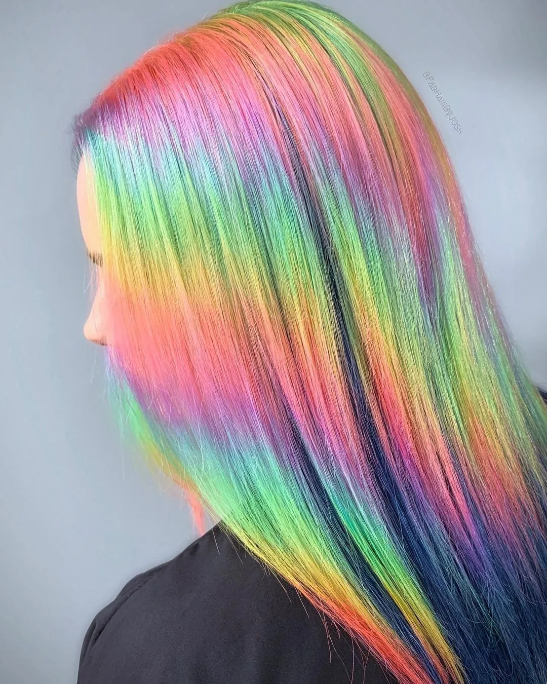 Bright rainbow colored hair (holographic hair) featuring shimmers of all colors in the rainbow