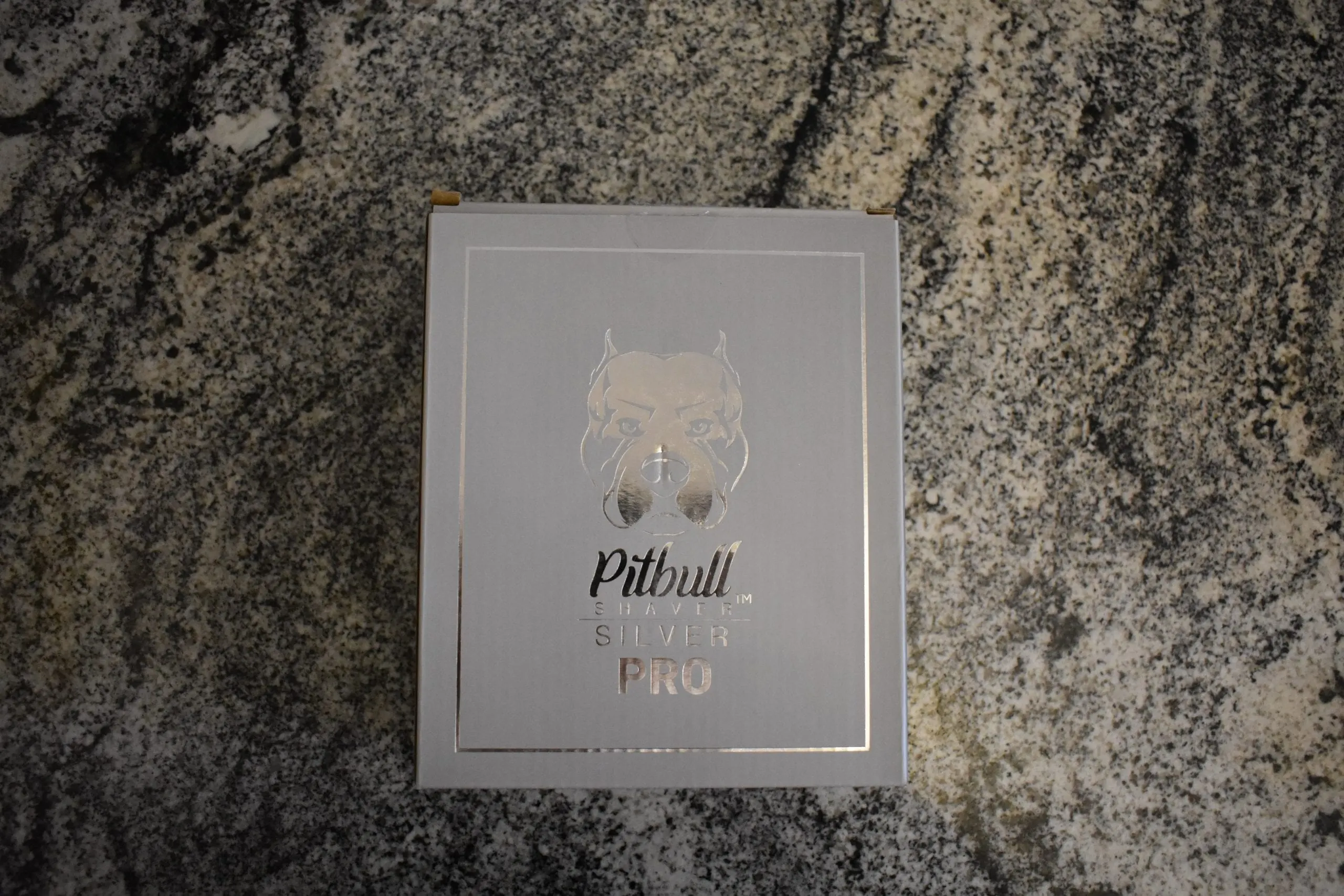 Pitbull silver pro (our pick for the best head shaver) sitting in its unopened box on my counter