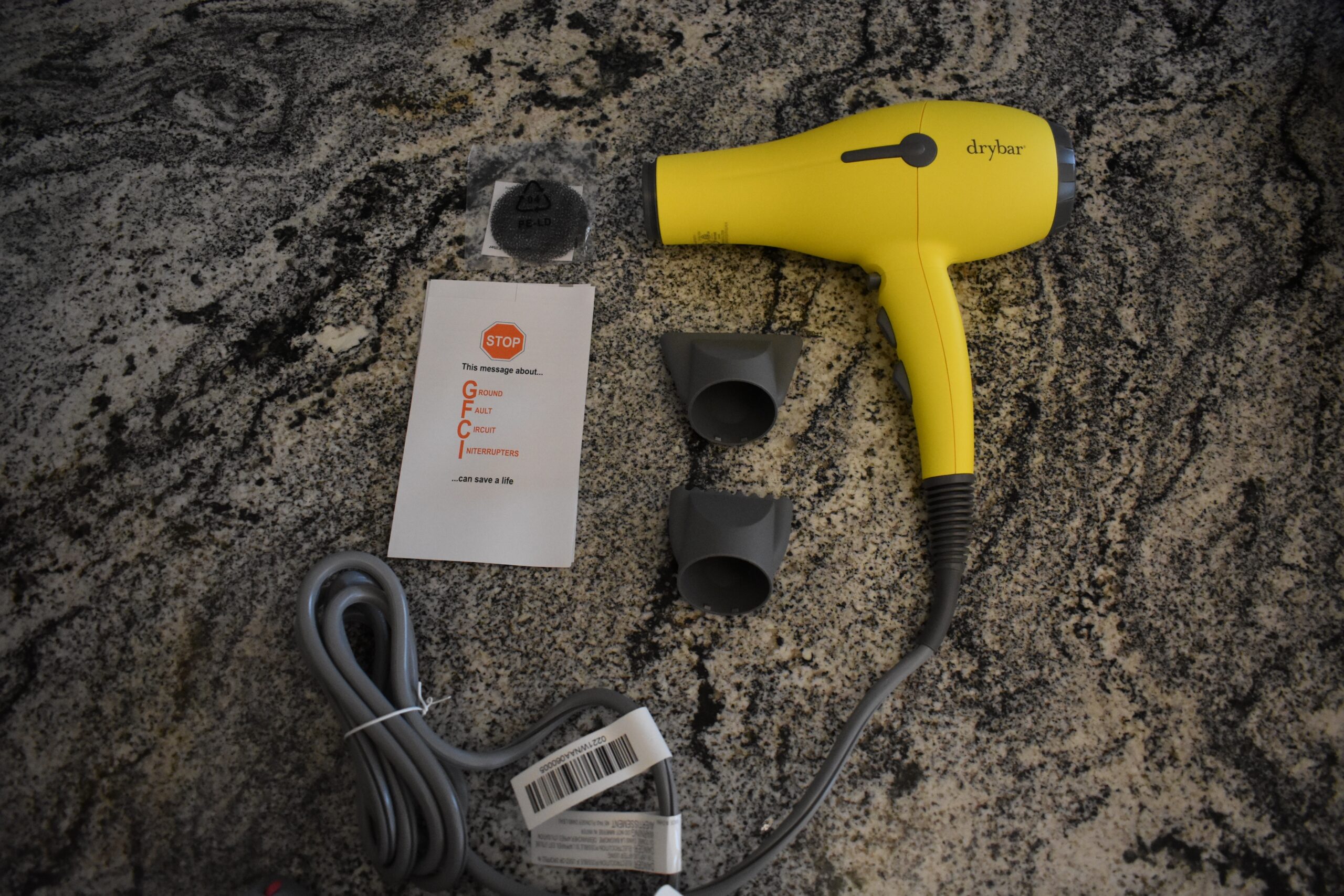 The drybar buttercup hair dryer and its accessories