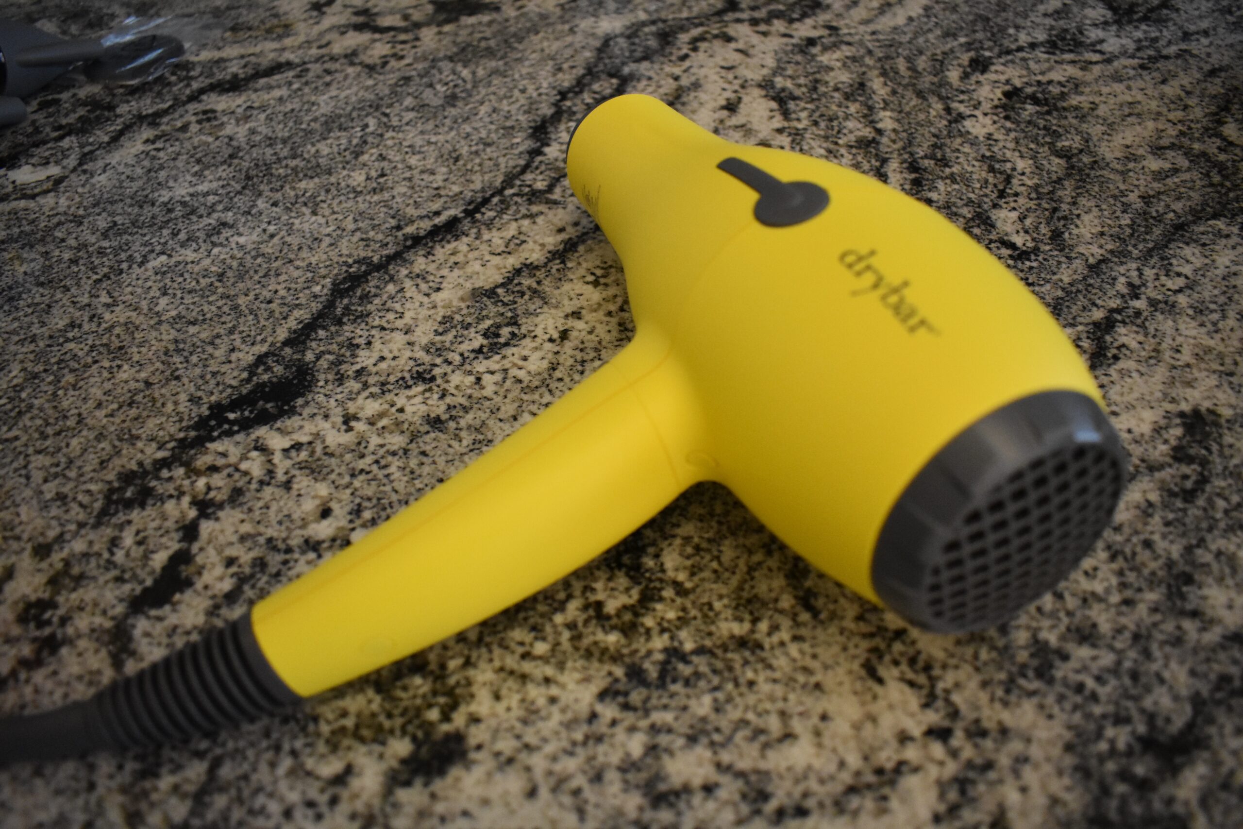 Side angle shot of the Drybar Buttercup hair dryer