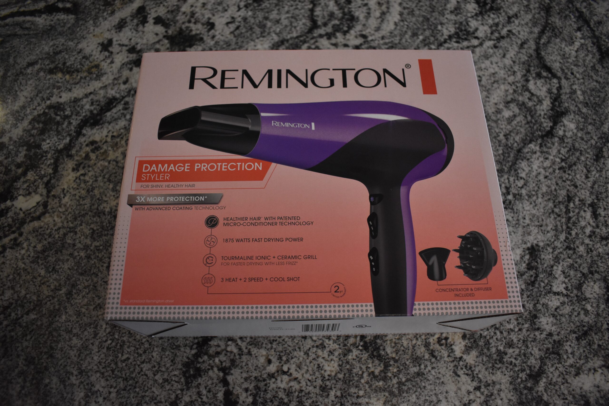 The Remington D3190 Damage Protection hair dryer in its box