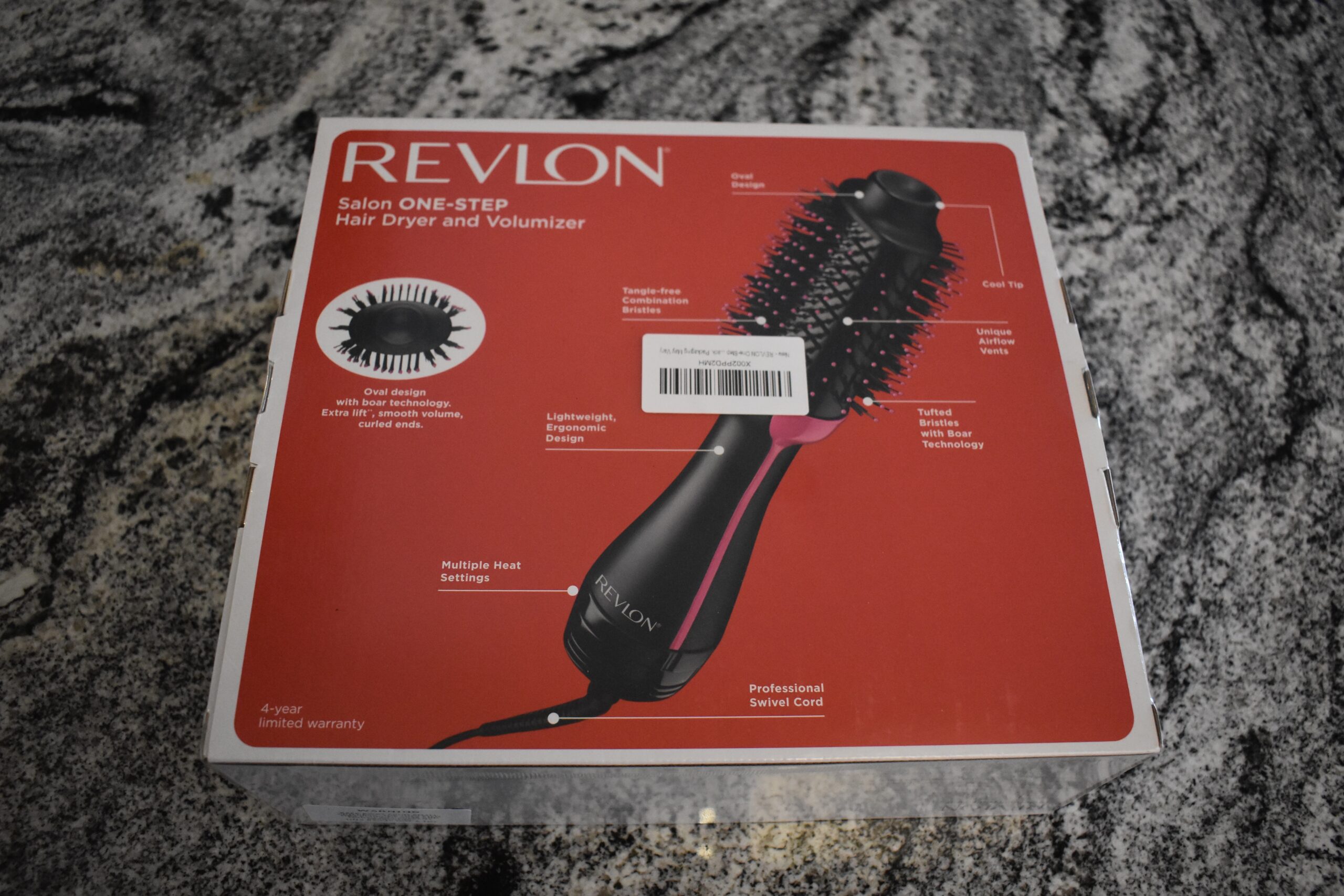 The Revlon hair dryer brush and its features on the back of the box