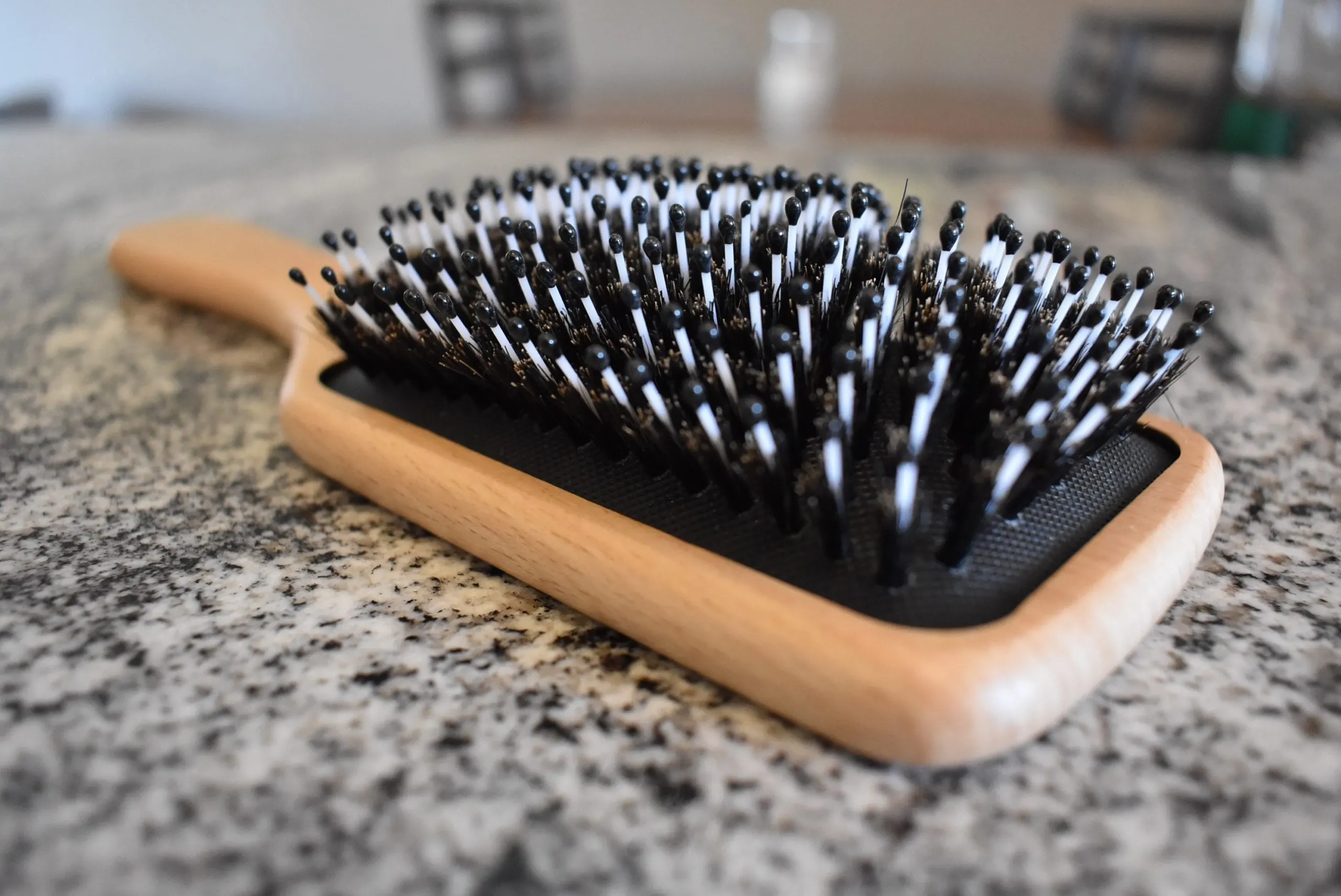 Angled profile of the Bsisme Boar Bristle and Nylon Paddle Hairbrush