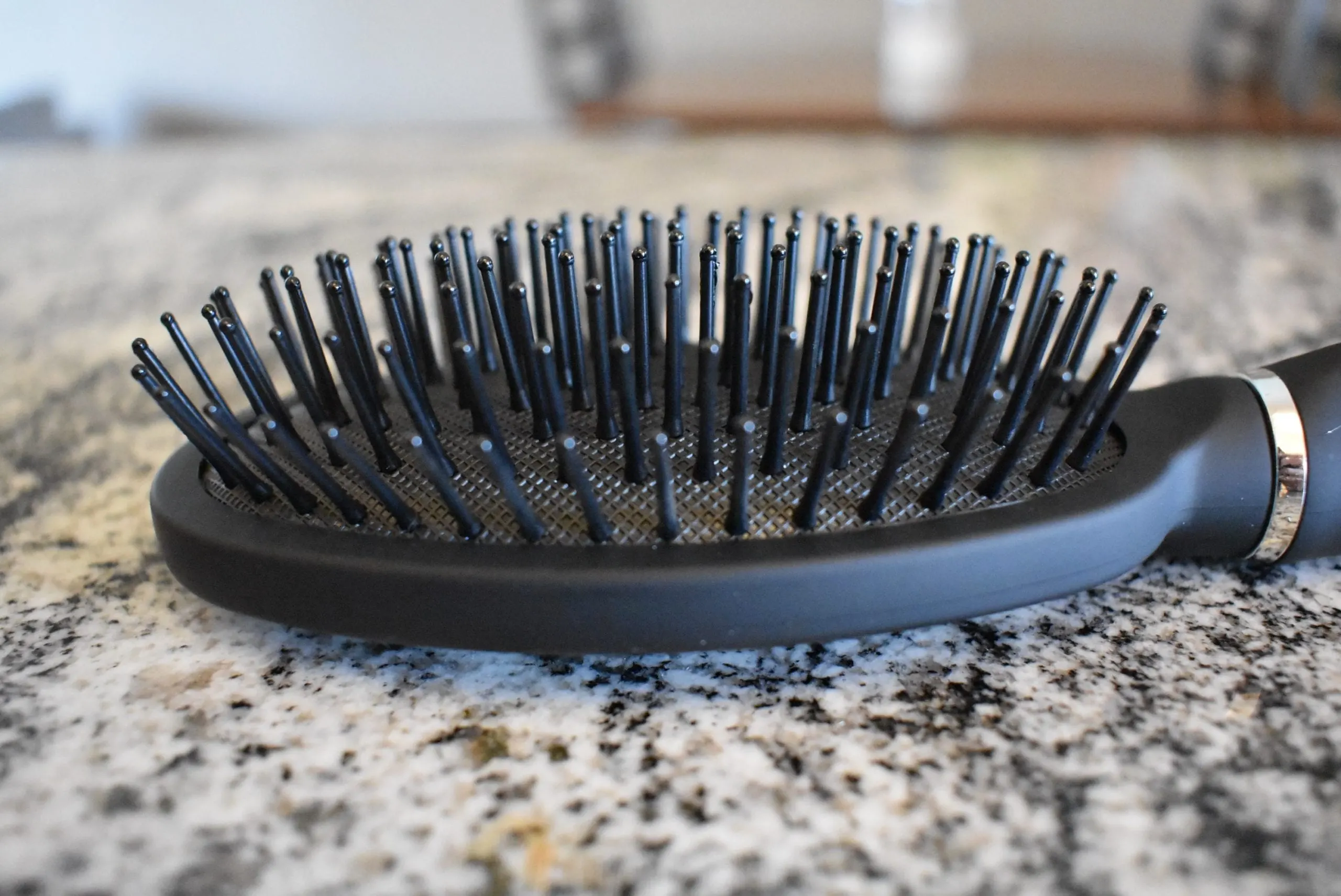 Close up of the best brush for damaged hair, the Revlon detangle and smooth cushioned brush