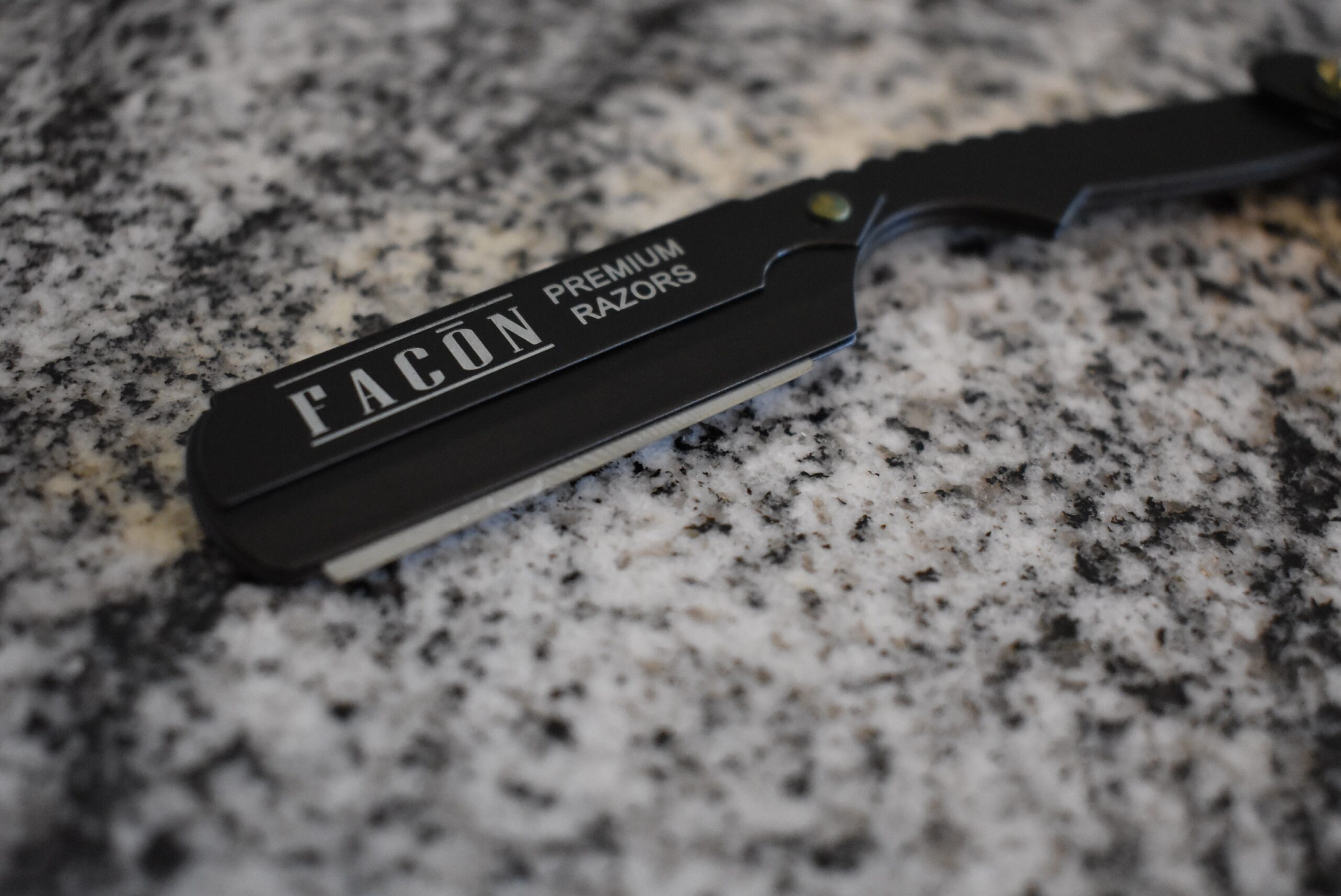 Facon straight razor close up (one of the best) with a blade in its clamp