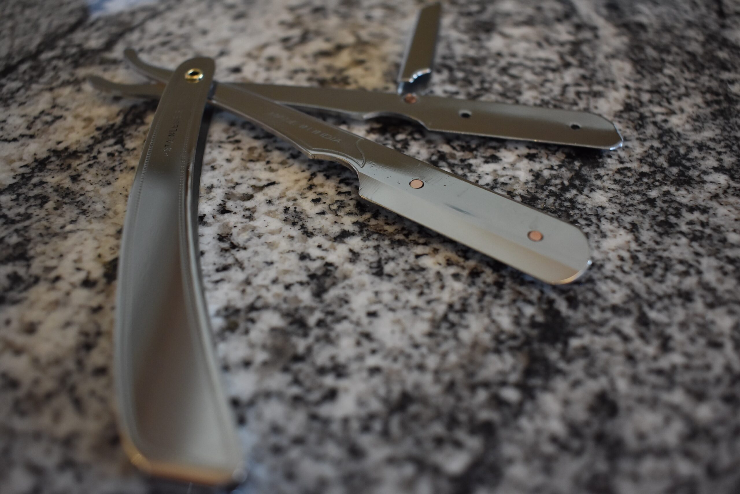 Close up of the Parker straight razor open on a counter