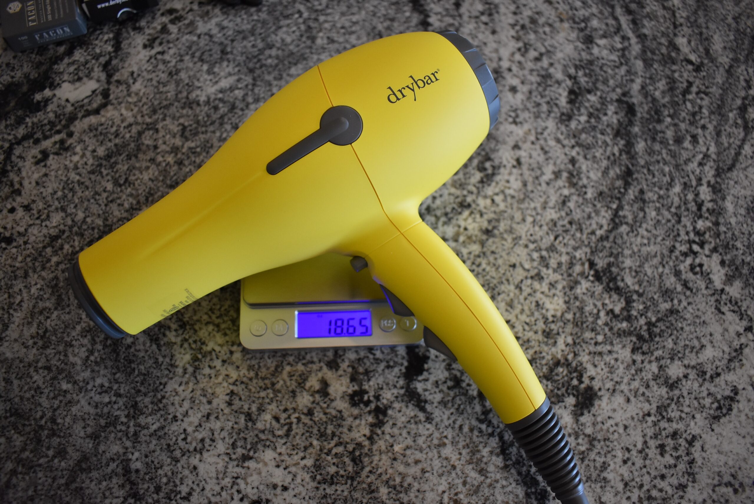 The Drybar Buttercup, one of the top hair dryers, on an oz kitchen scale
