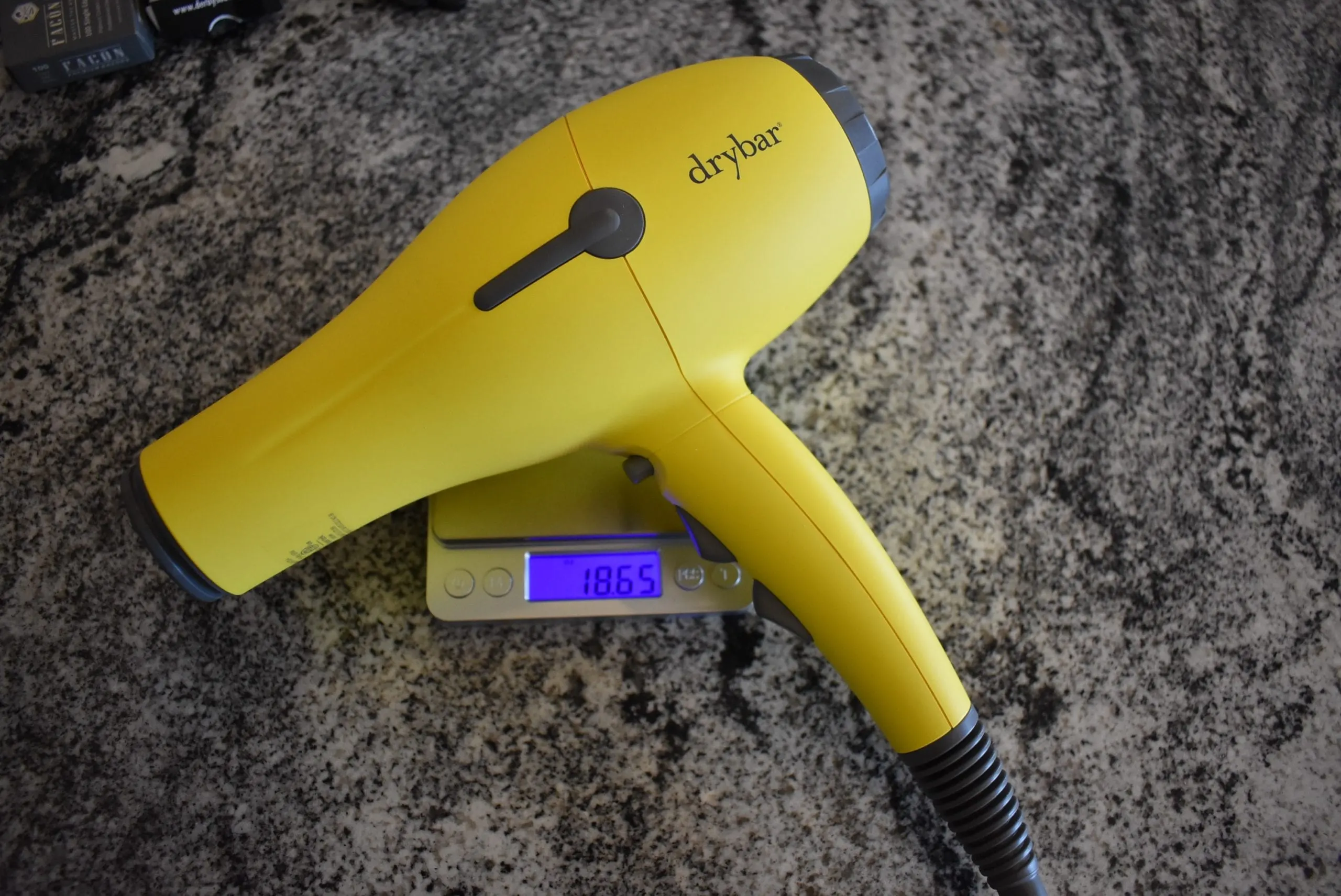 The Drybar Buttercup, one of the top hair dryers, on an oz kitchen scale