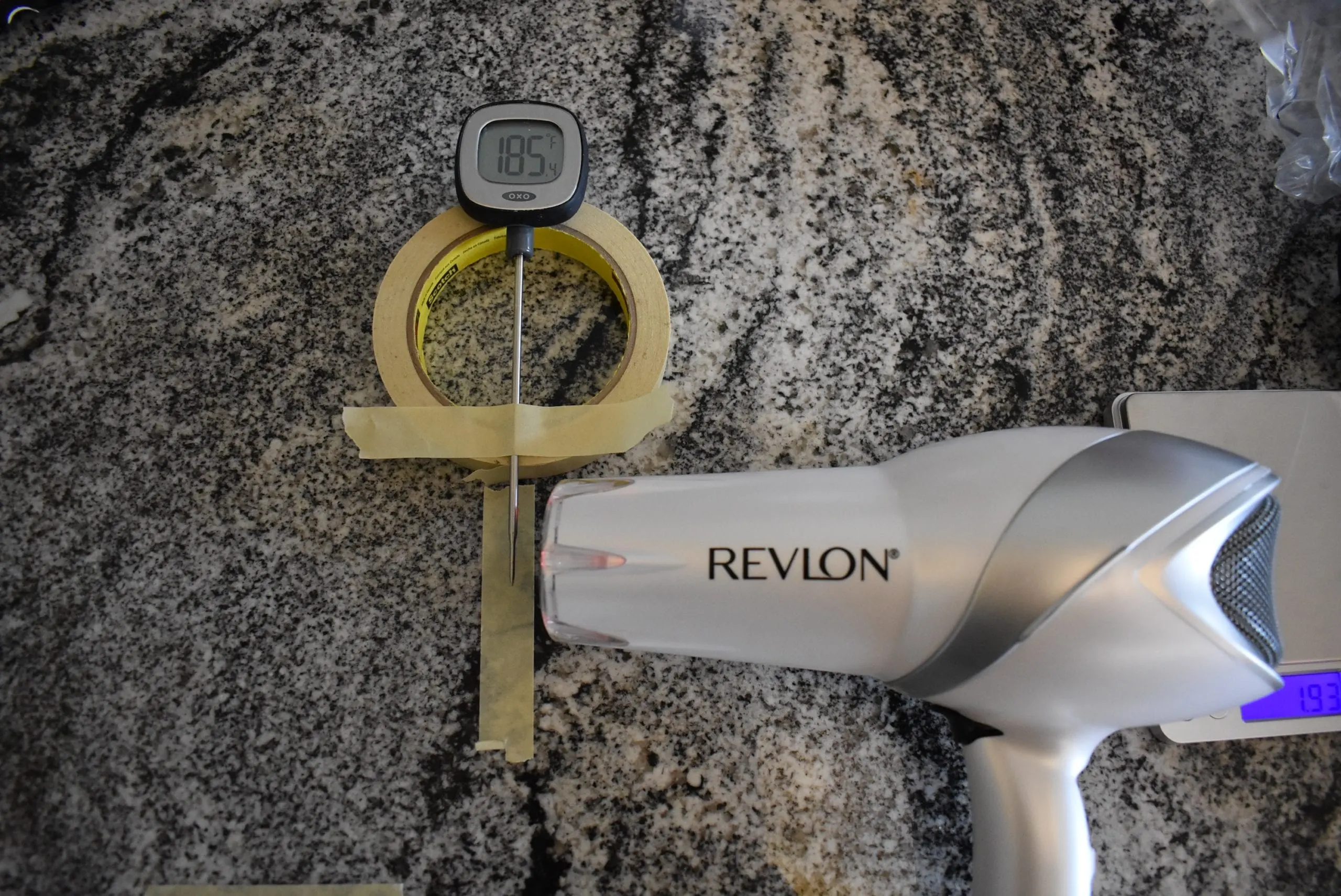 The Revlon 1875 watt hair dryer registering 185 degrees farenheit on a kitchen thermometer