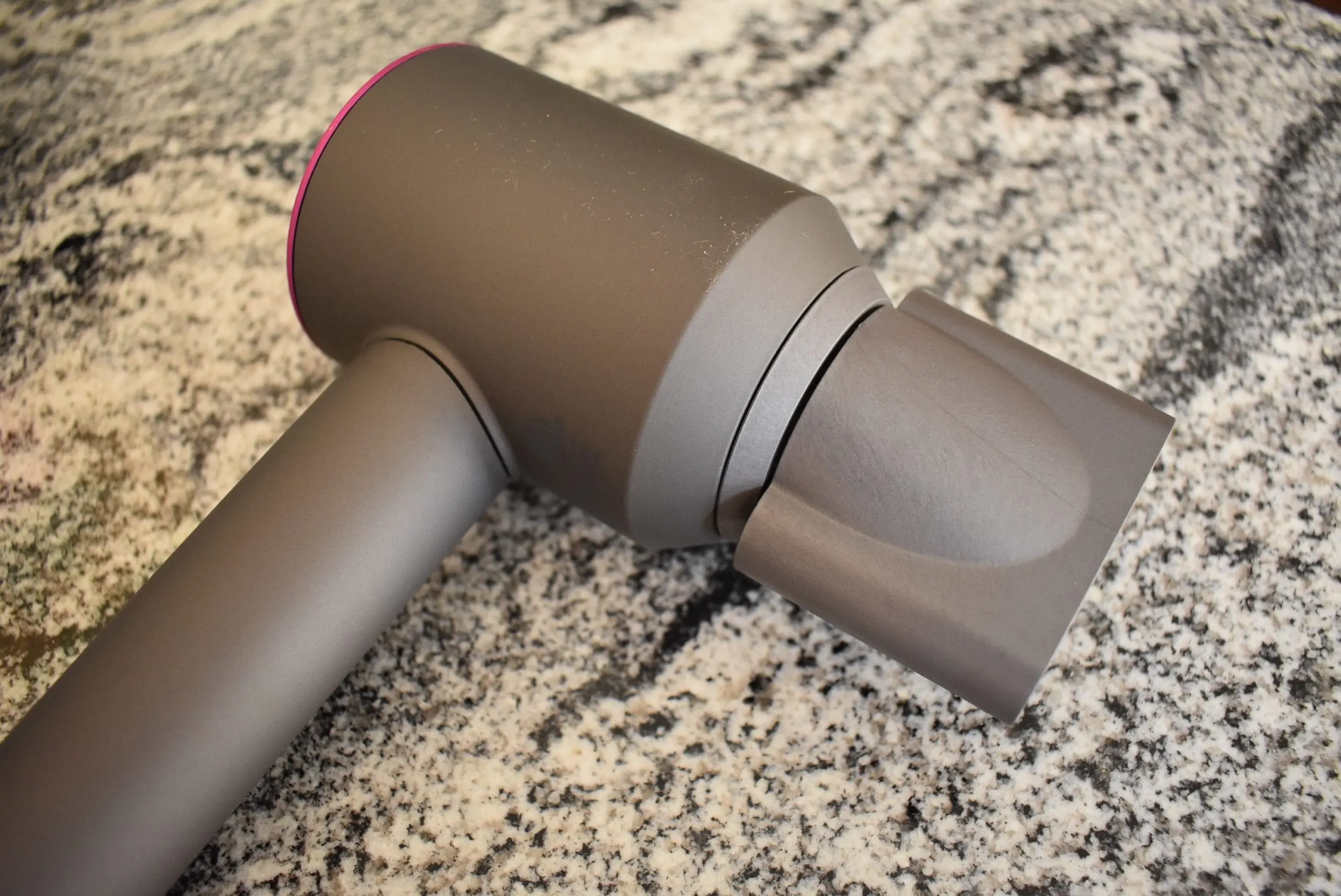 For a dyson hair dryer review, an attachment clips onto the front via a magnet