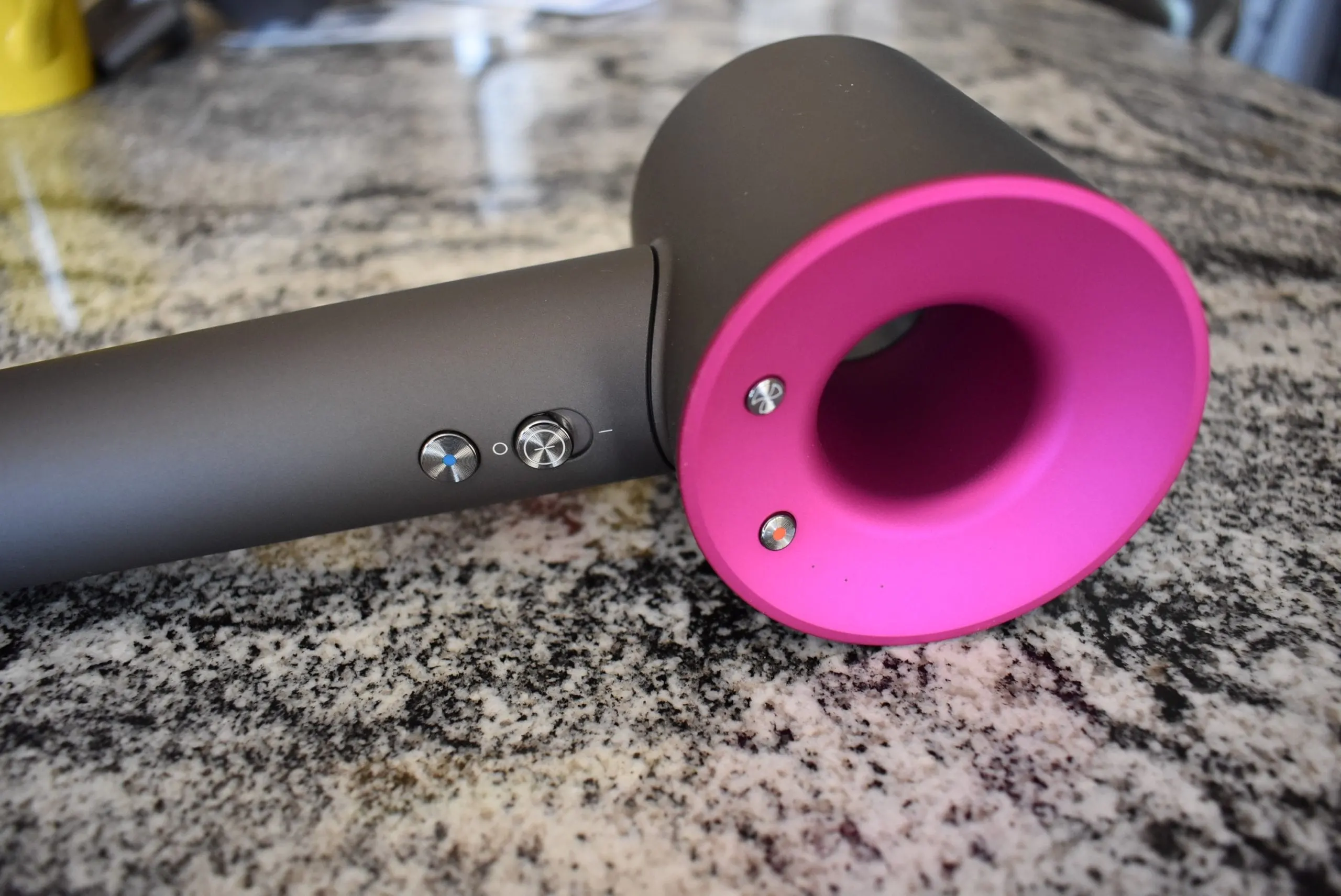 Close up of the dyson hair dryer and its buttons