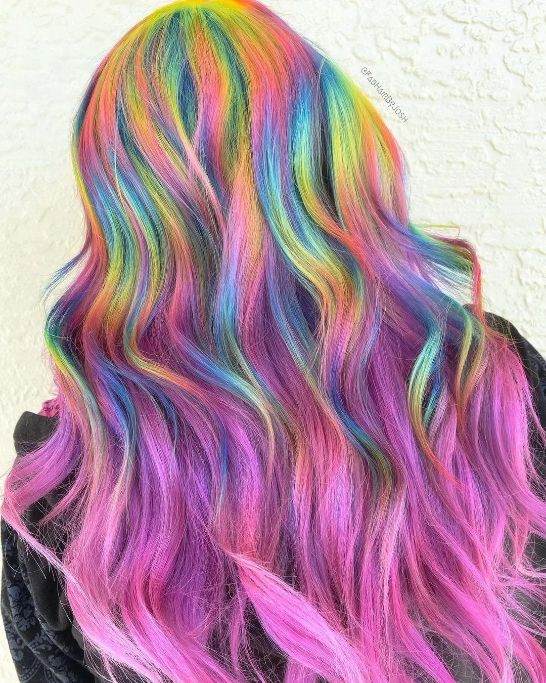 Half and Half hairstyle featuring dyed holographic coloring on the top and bright pink and purple on the bottom half
