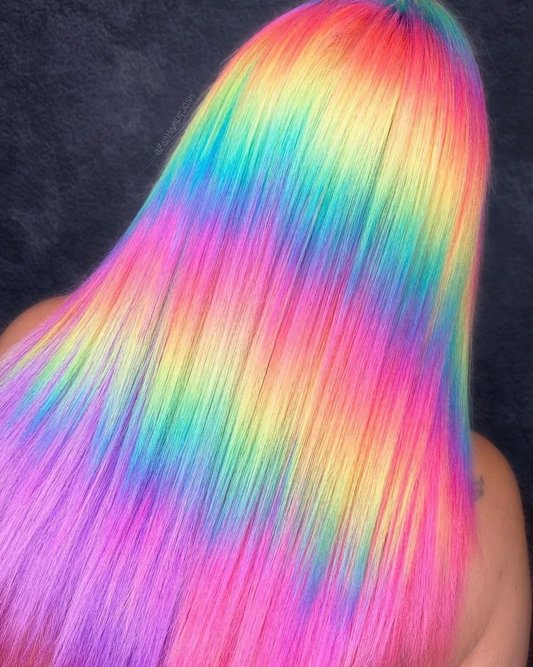 Holographic waves hairstyle on woman in a sleeveless shirt looking away from the camera