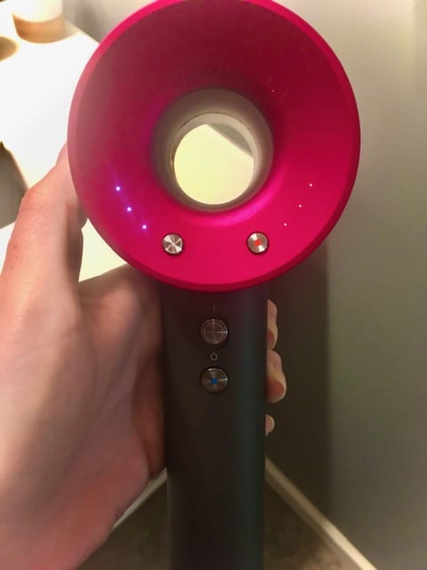 Close-up of the Dyson hair dryer in action as part of a hands-on review