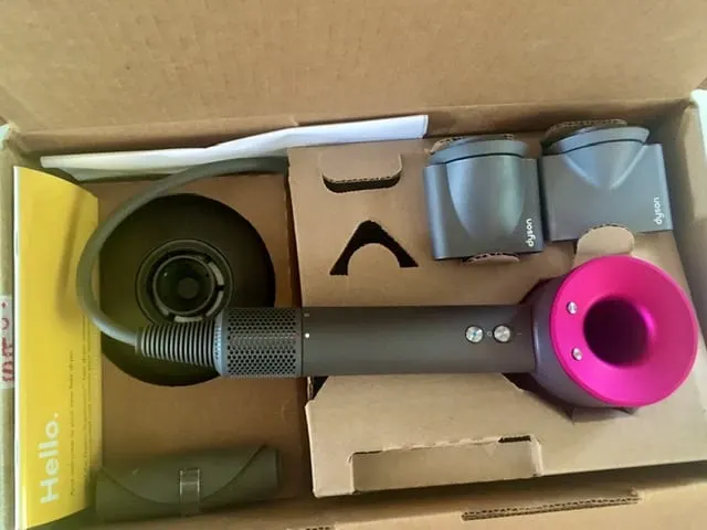 Contents of the box for the unboxing section of the Dyson Supersonic hair dryer review