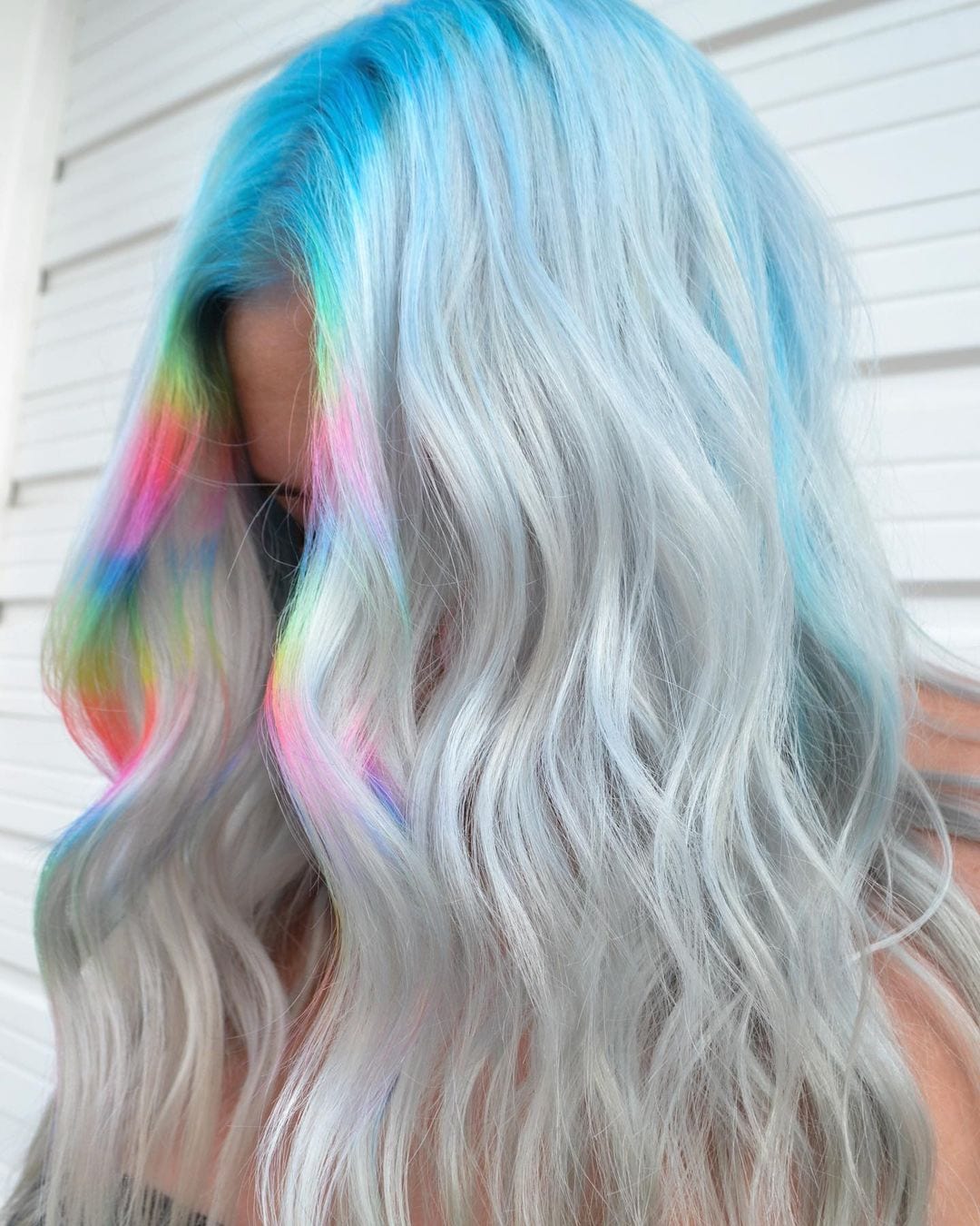 Prismatic flecks halographic hair on a blonde woman