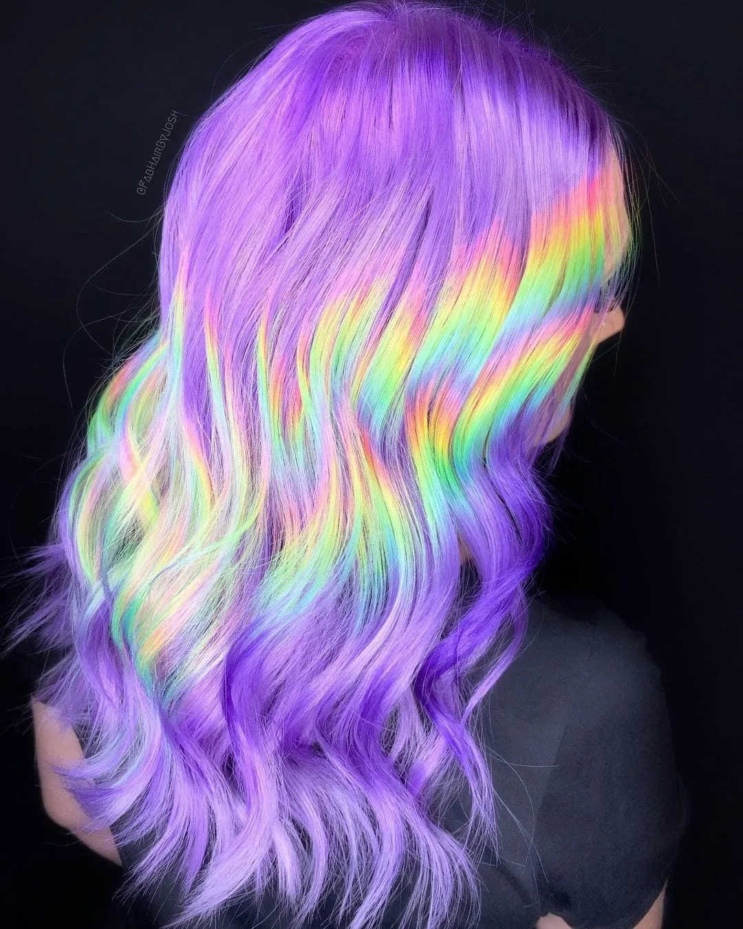 Squiggly holographic hair on a model featuring a side profile