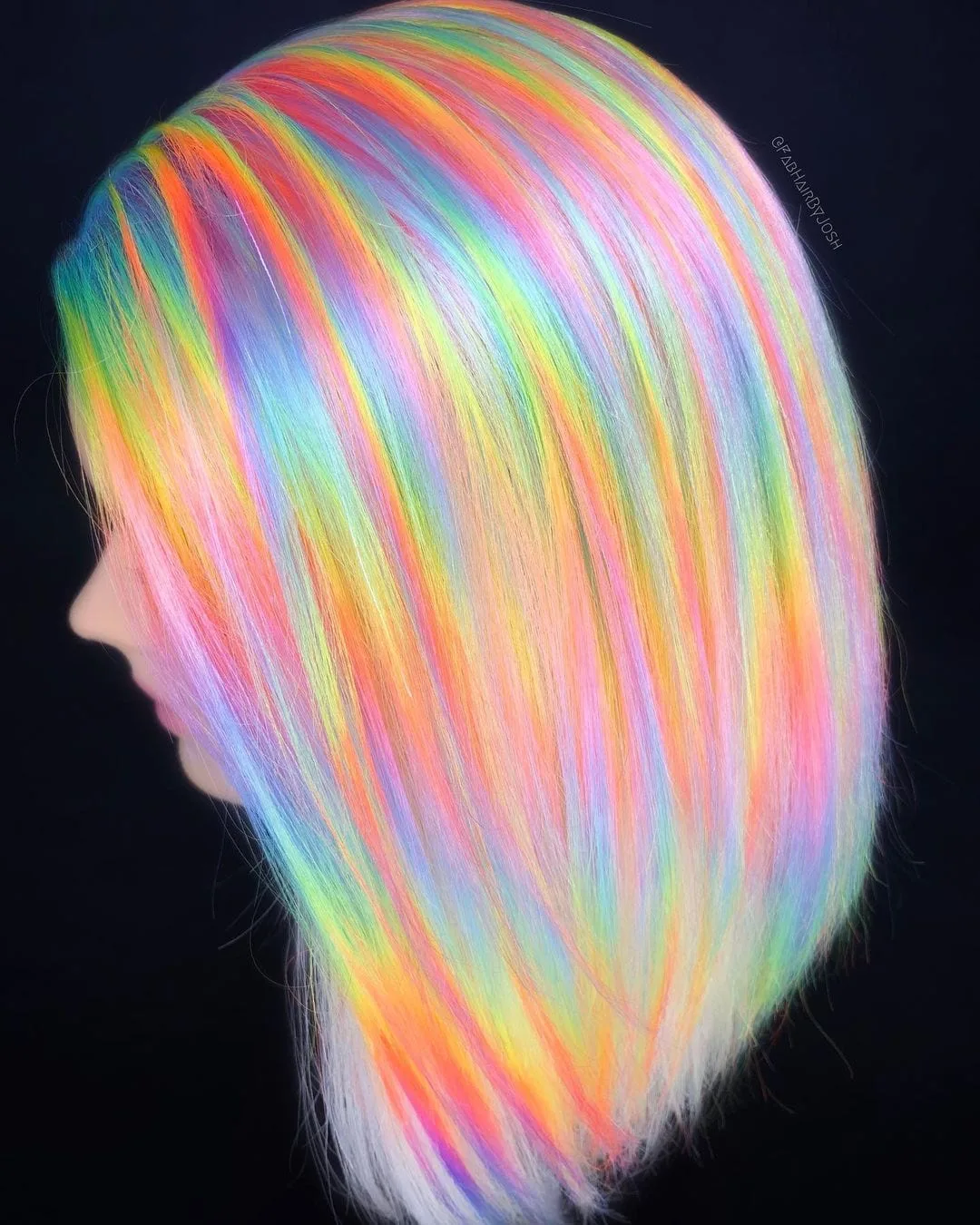 Vivid Holographic hair with pink, blue, and yellow swirls