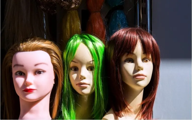 Wigs on a mannequin in various color for a piece on what is semi-permanent hair color