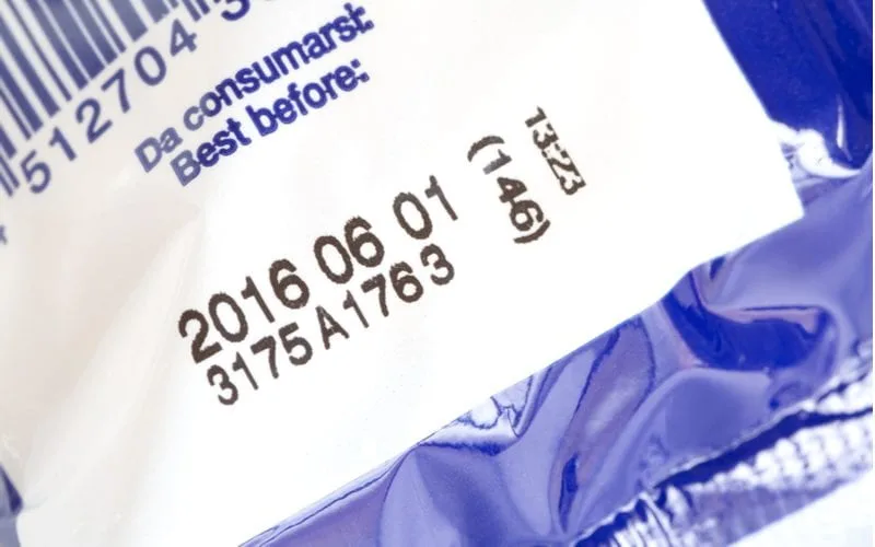 Close up of a batch and bar code that you'd tend to find on a shampoo bottle to tell when it expires