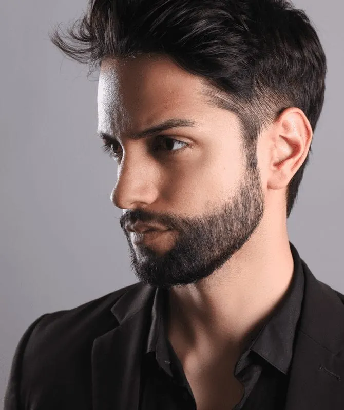 For a type of fade example, a blown-out low fade on a guy in a suit and open collar black shirt