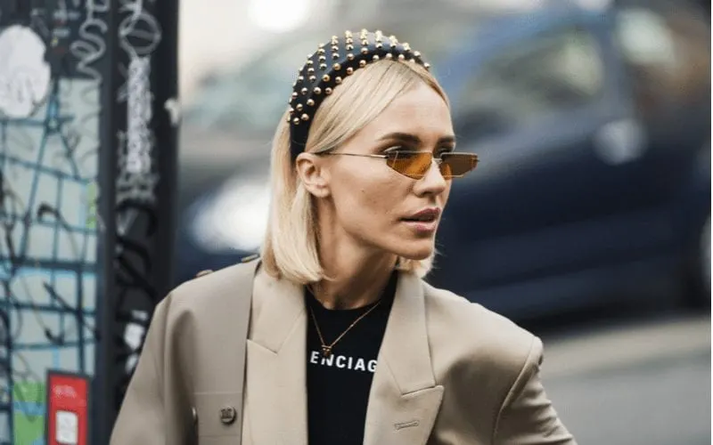 Bold Headband on a woman wearing Balenciaga standing in traffic