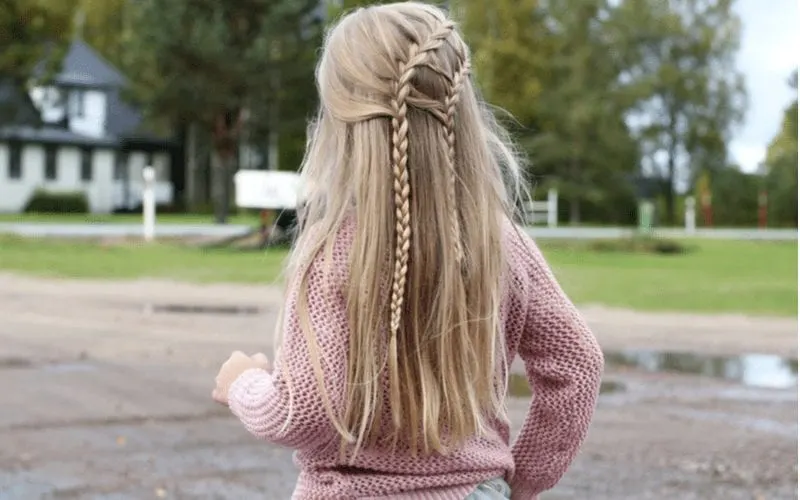 A little girl with a braided hairstyle. Two waterfall braids on a child.