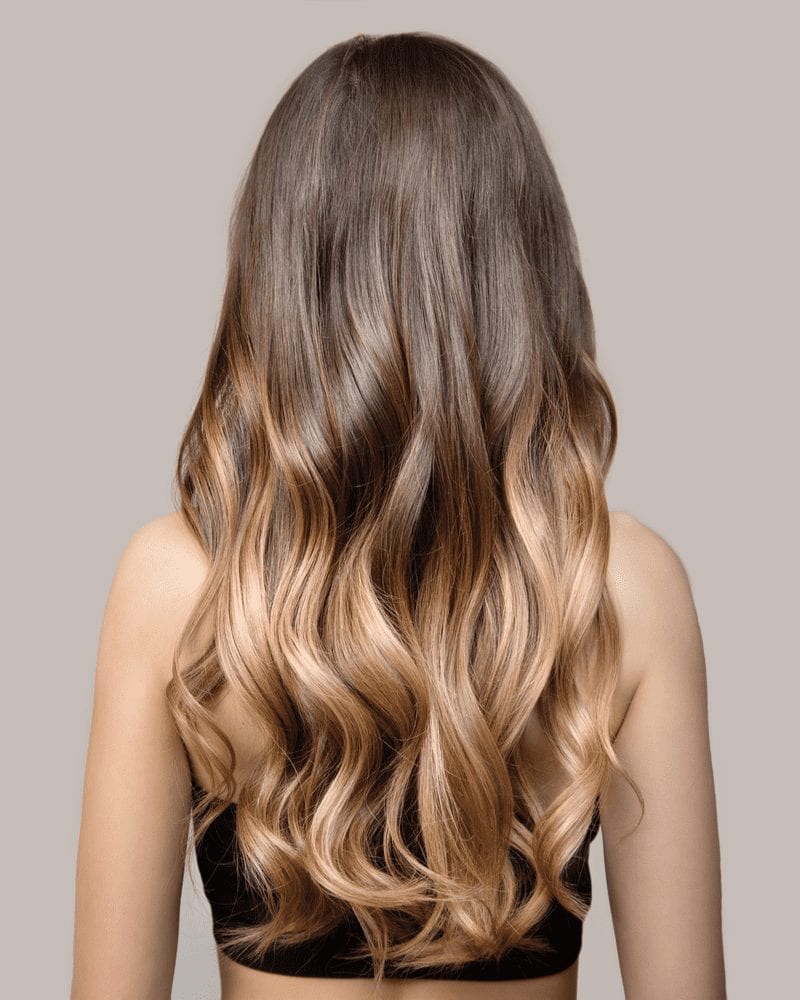 Woman with a long haircut in the Balayage Layered Waves style