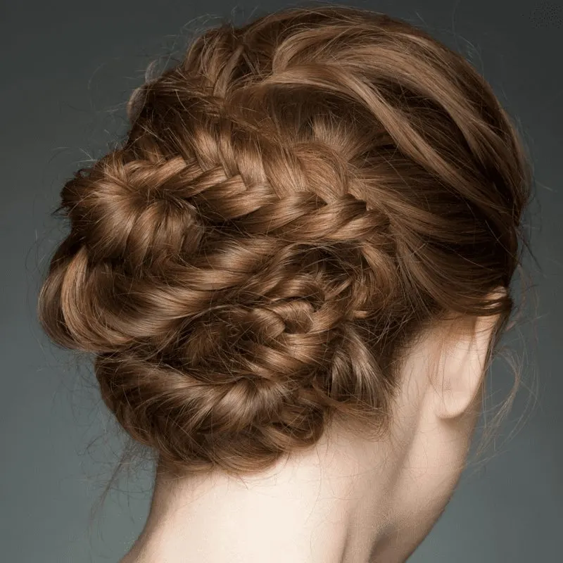 Woman with a serpentine fishtail bun for a piece on types of braids