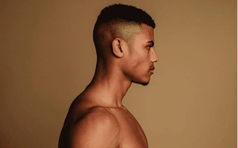 High skin fade on a man in a side profile