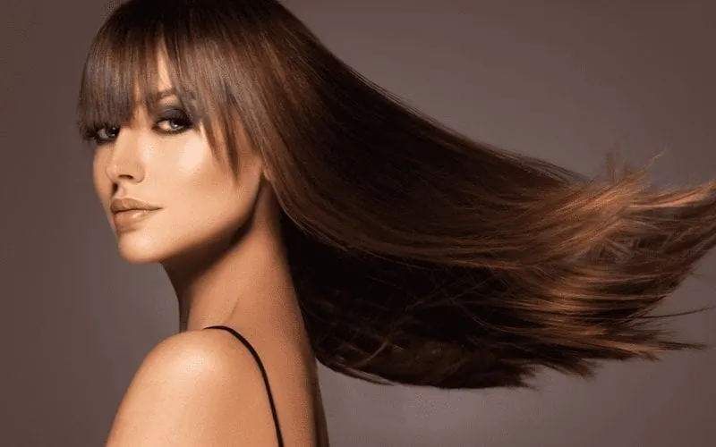 Piece-y Blunt Bangs on a beautiful eastern european woman with shiny brown hair