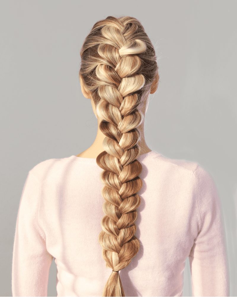 Woman with a beautiful braided hairstyle looking away from the camera