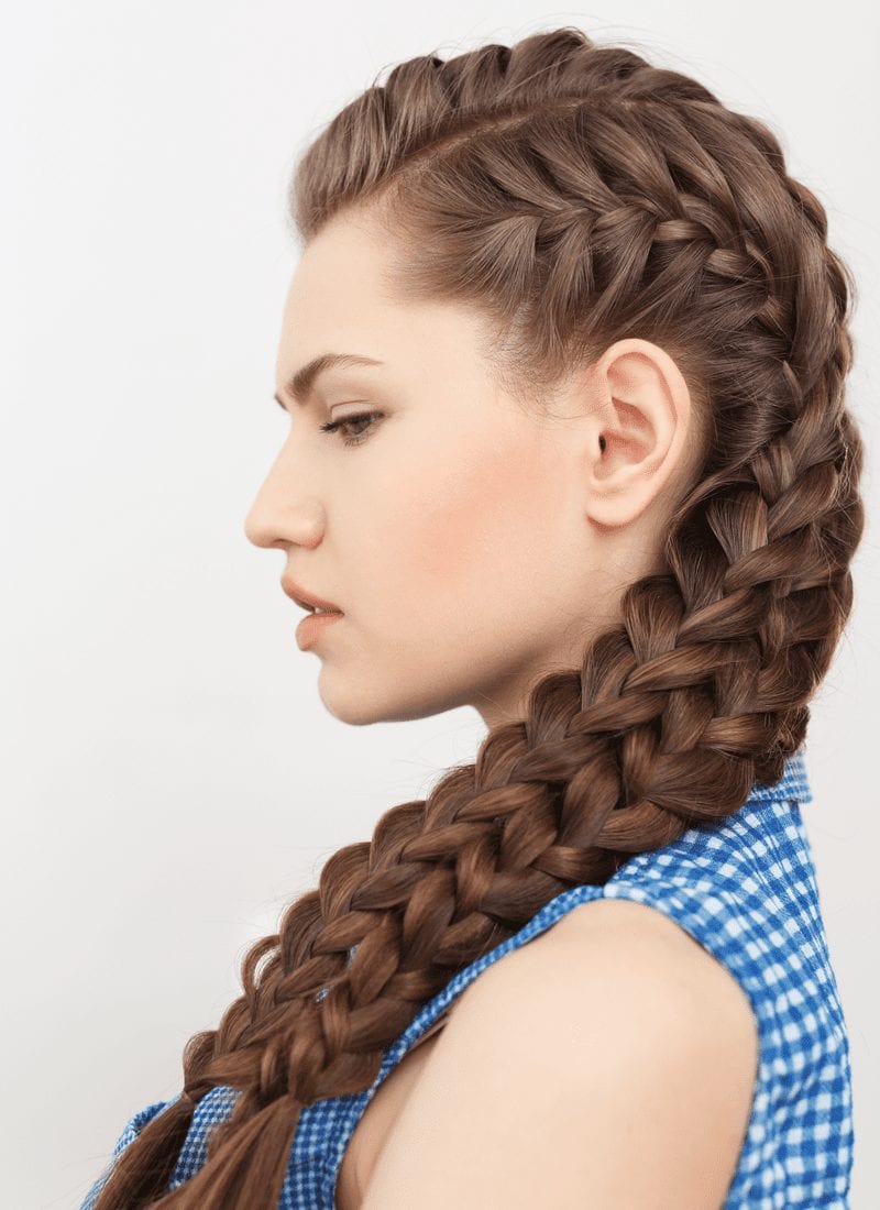 Lady in a blue checkered shirt with quadruple french braids