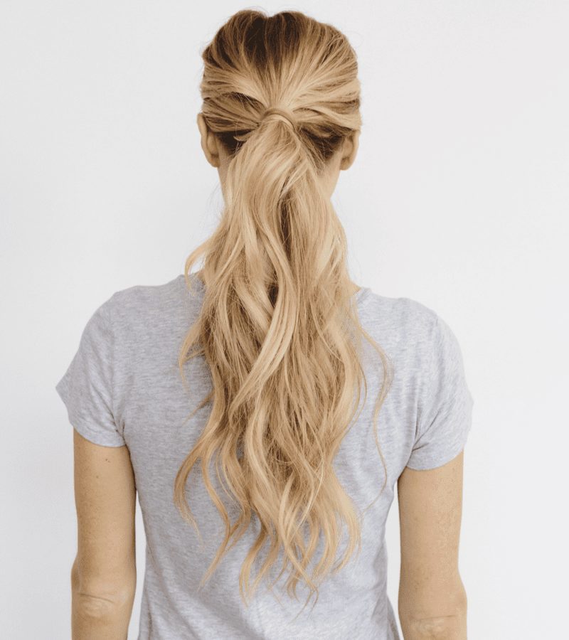 As a layered haircut inspo, a woman with Perfect Ponytail Layers as viewed from the back