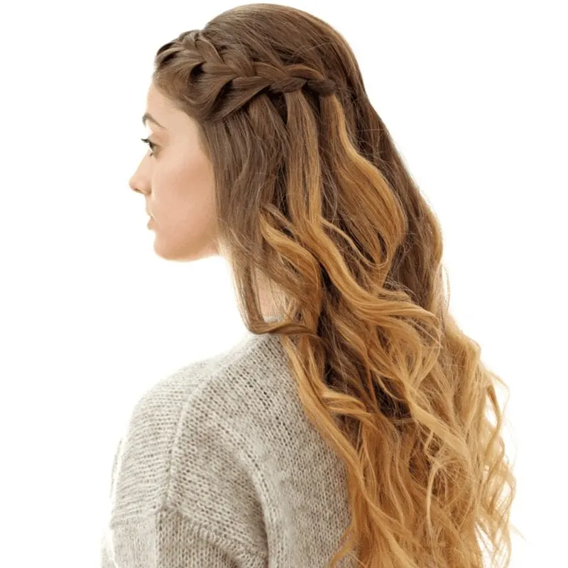 Image of a woman with waterfall braids while she wears a knitted sweater